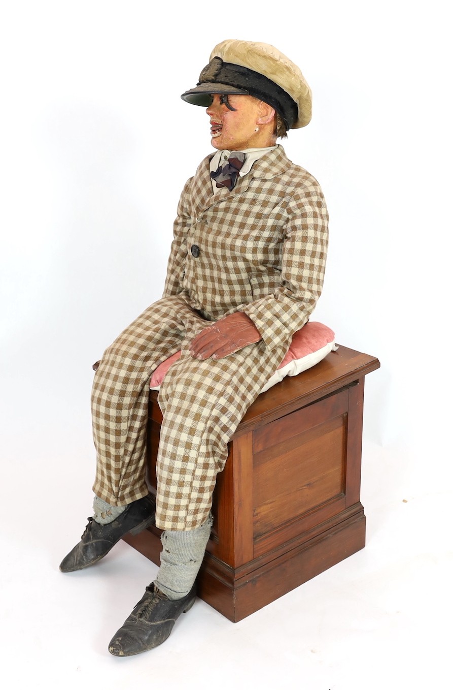 A Leonard Insull ventriloquist's dummy, approx. 130cm high, with walnut box seat